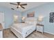 Tranquil bedroom with white bedding and neutral decor at 206 Gondola Park Dr # 206, Venice, FL 34292
