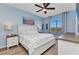 Serene bedroom with large window view and a ceiling fan at 206 Gondola Park Dr # 206, Venice, FL 34292