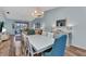 Light-filled dining room featuring stylish decor and a view of the community at 206 Gondola Park Dr # 206, Venice, FL 34292