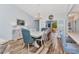 Open dining room with stylish furniture, wood floors, and bright natural light at 206 Gondola Park Dr # 206, Venice, FL 34292