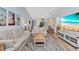 Spacious living area with beach-themed decor and ample seating at 206 Gondola Park Dr # 206, Venice, FL 34292