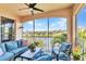 Screened-in patio area with comfortable seating and scenic lake views at 206 Gondola Park Dr # 206, Venice, FL 34292