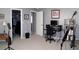 Spacious bedroom featuring a walk-in closet, neutral paint, carpet floors, and a desk area at 2119 Pellam Blvd, Port Charlotte, FL 33948