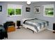 Bedroom with two windows, carpet floors, a ceiling fan, and neutral paint at 2119 Pellam Blvd, Port Charlotte, FL 33948
