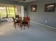 Dining area with table and chairs, sliding door for natural light and access to exterior at 2119 Pellam Blvd, Port Charlotte, FL 33948