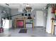 Garage with plenty of storage, shelving, and a work bench at 2119 Pellam Blvd, Port Charlotte, FL 33948