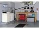Functional laundry area with washer, dryer, work table, storage and overhead cabinets at 2119 Pellam Blvd, Port Charlotte, FL 33948