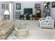 Inviting living room with plush seating, entertainment center, and neutral carpet at 2119 Pellam Blvd, Port Charlotte, FL 33948