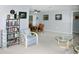 Open-concept living room with dining area, neutral walls, and comfortable furniture arrangement at 2119 Pellam Blvd, Port Charlotte, FL 33948