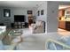 Spacious living room with neutral tones and view into kitchen at 2119 Pellam Blvd, Port Charlotte, FL 33948