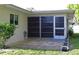 Enclosed patio with sliding glass doors, exterior view at 2119 Pellam Blvd, Port Charlotte, FL 33948