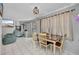 Bright dining area with a table and chairs, an adjacent living area, and large windows at 2465 Deedra St, Port Charlotte, FL 33952