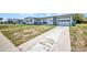 Charming single-story home with stone accents, attached garage, and a long driveway at 2465 Deedra St, Port Charlotte, FL 33952