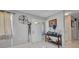 Bright foyer with tiled flooring, a console table, and an entryway with a glass accented door at 2465 Deedra St, Port Charlotte, FL 33952