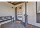 Inviting front porch featuring decorative columns, a bench, a welcome mat, and a screen door at 2465 Deedra St, Port Charlotte, FL 33952