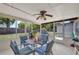 Screened-in patio with ceiling fan, outdoor dining set and BBQ grill at 2465 Deedra St, Port Charlotte, FL 33952
