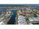 Aerial view of waterfront condo community, boat docks and nearby lake at 2521 W Marion Ave # 912, Punta Gorda, FL 33950