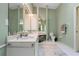 Well-lit bathroom with vanity, toilet, and decorative rug at 2521 W Marion Ave # 912, Punta Gorda, FL 33950
