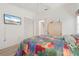Charming bedroom with TV, closet, and neutral walls at 2521 W Marion Ave # 912, Punta Gorda, FL 33950