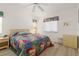 Cozy bedroom with wood-look floors, window, and neutral-toned decor at 2521 W Marion Ave # 912, Punta Gorda, FL 33950