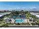 Aerial view featuring the community pool and a gazebo on the central lake at 2521 W Marion Ave # 912, Punta Gorda, FL 33950
