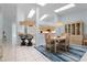 Bright dining area featuring tile floors, a stylish chandelier and convenient breakfast bar at 2521 W Marion Ave # 912, Punta Gorda, FL 33950