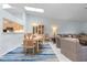 Charming dining area with a chandelier, adjacent to the living room and open kitchen at 2521 W Marion Ave # 912, Punta Gorda, FL 33950