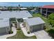 Beautifully landscaped villa featuring an arched entryway and a garage at 2521 W Marion Ave # 912, Punta Gorda, FL 33950