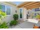 Front of the villa showcases landscaping, porch, windows, and front door at 2521 W Marion Ave # 912, Punta Gorda, FL 33950