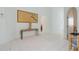 Spacious hallway with tiled floors, decorative art, and arched doorways that add architectural charm at 2521 W Marion Ave # 912, Punta Gorda, FL 33950