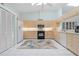 Well-equipped kitchen with modern appliances, light wood cabinetry, and a stylish area rug at 2521 W Marion Ave # 912, Punta Gorda, FL 33950