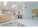 Open kitchen featuring modern appliances, a breakfast bar, and seamless flow to the living areas at 2521 W Marion Ave # 912, Punta Gorda, FL 33950