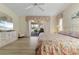 Light and airy main bedroom features an entertainment center and lanai access at 2521 W Marion Ave # 912, Punta Gorda, FL 33950
