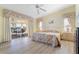 Relaxing main bedroom with light wood floors, slider doors, and direct lanai access at 2521 W Marion Ave # 912, Punta Gorda, FL 33950