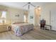 Bright main bedroom with light walls, light wood floors, and a floral comforter at 2521 W Marion Ave # 912, Punta Gorda, FL 33950