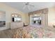 Comfortable main bedroom with slider doors to the lanai and an entertainment center at 2521 W Marion Ave # 912, Punta Gorda, FL 33950