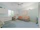 Bright home office features built-in desk, storage, and comfortable seating area with a ceiling fan at 2521 W Marion Ave # 912, Punta Gorda, FL 33950