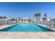 Community pool and clubhouse area with clear blue skies at 2521 W Marion Ave # 912, Punta Gorda, FL 33950