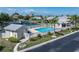 Aerial view of the pool and clubhouse in a waterfront community at 2521 W Marion Ave # 912, Punta Gorda, FL 33950