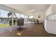 Sunroom with a tile floor, ceiling fan, and beautiful views of the water at 2521 W Marion Ave # 912, Punta Gorda, FL 33950