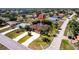 Expansive aerial view of this home showcases its well-manicured lawn and prime location on a corner lot at 25538 Rampart Blvd, Punta Gorda, FL 33983