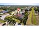 Aerial view of a property with a private pool, lush landscaping, and a desirable neighborhood location at 25538 Rampart Blvd, Punta Gorda, FL 33983