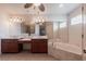 Bright bathroom featuring double sinks, soaking tub and shower at 25538 Rampart Blvd, Punta Gorda, FL 33983