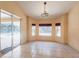 Bright dining area with large windows, tiled floor, and pool view at 25538 Rampart Blvd, Punta Gorda, FL 33983