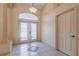 Welcoming foyer featuring decorative tile, double front doors, and ample natural light creating an inviting entrance at 25538 Rampart Blvd, Punta Gorda, FL 33983