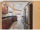 Well-equipped kitchen with stainless steel appliances, dark wood cabinets, and open layout, perfect for entertaining at 25538 Rampart Blvd, Punta Gorda, FL 33983