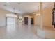 Expansive living room with tile flooring, large windows, and a seamless flow into other areas of the home at 25538 Rampart Blvd, Punta Gorda, FL 33983