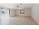 Bright living room with tile floors and sliding glass doors leading to a screened pool at 25538 Rampart Blvd, Punta Gorda, FL 33983