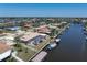 Aerial view of waterfront property with private boat dock and screened-in pool at 259 Fields Ter, Port Charlotte, FL 33952