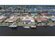 Aerial view of waterfront property with pool and private boat dock at 259 Fields Ter, Port Charlotte, FL 33952